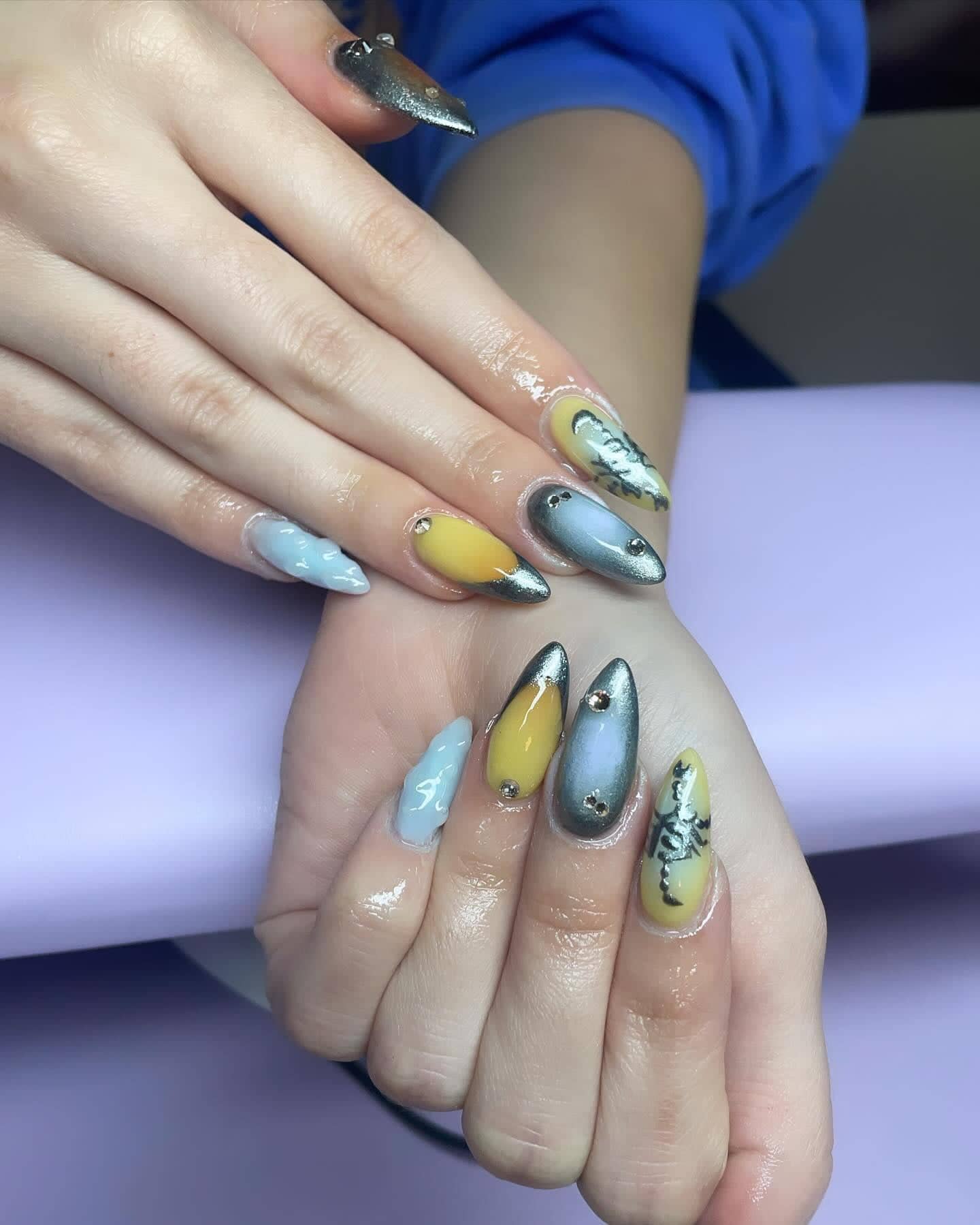 Almond set mixing silver chrome, butter yellow and baby blue with hand-painted script lettering.