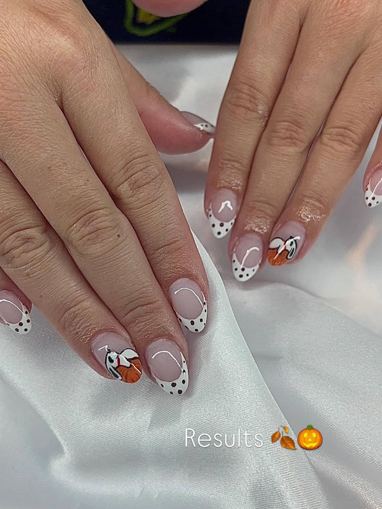 Almond fall set with white polka-dot French tips and hand-painted cartoon dog character art.